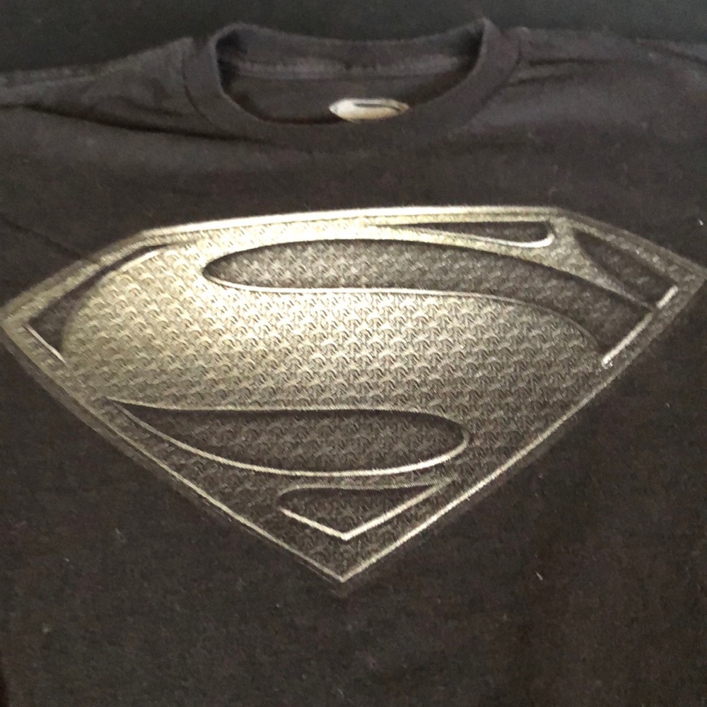 Man of Steel T size M looks more like small